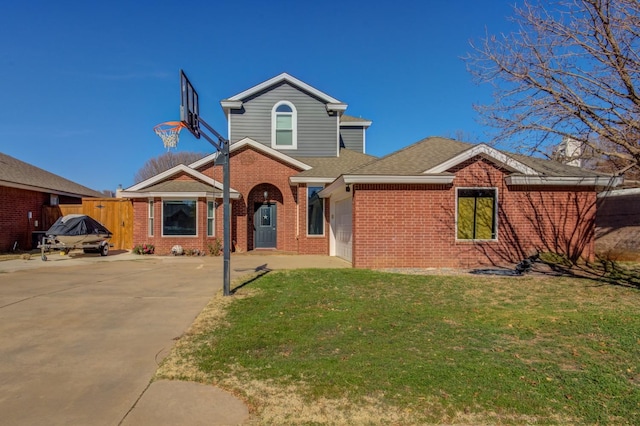 front of property with a garage and a front lawn