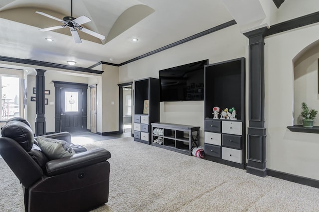 carpeted living room with crown molding, ceiling fan, and ornate columns