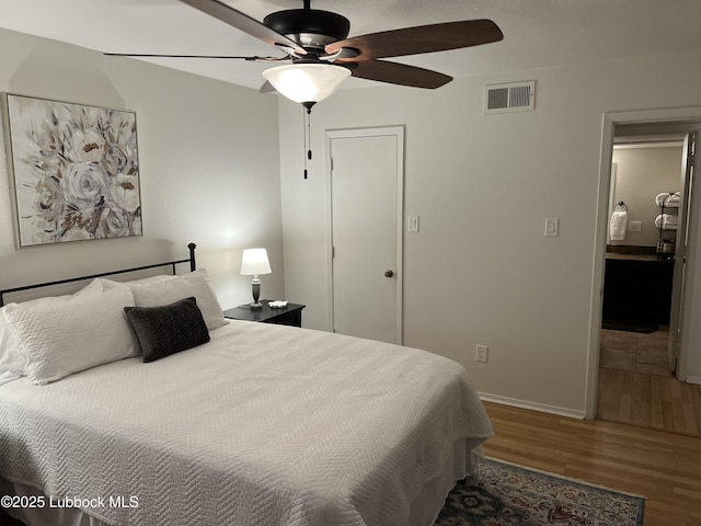 8601 Memphis Dr Unit B-40, Lubbock, TX 79423 - bedroom with wood finished floors, baseboards, a closet, and a ceiling fan