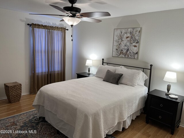 8601 Memphis Dr Unit B-40, Lubbock, TX 79423 - bedroom featuring wood finished floors and ceiling fan