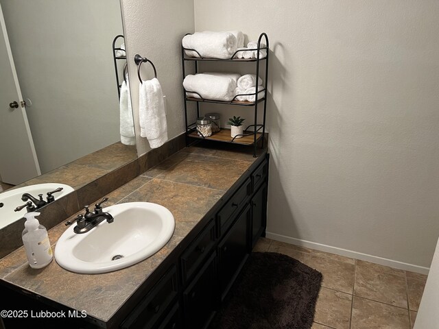 8601 Memphis Dr Unit B-40, Lubbock, TX 79423 - bathroom with vanity and baseboards