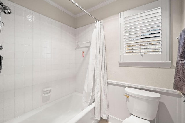 bathroom with crown molding, shower / bath combo, and toilet