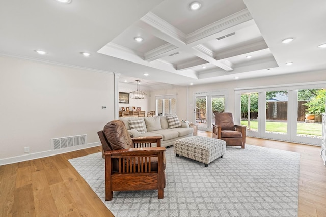 living room featuring beamed ceiling, crown molding, coffered ceiling, and light hardwood / wood-style flooring