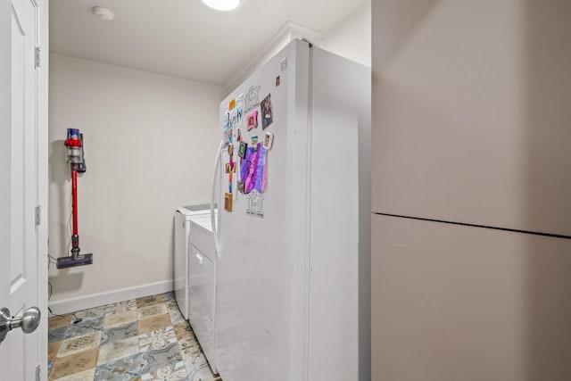 laundry area with washing machine and dryer