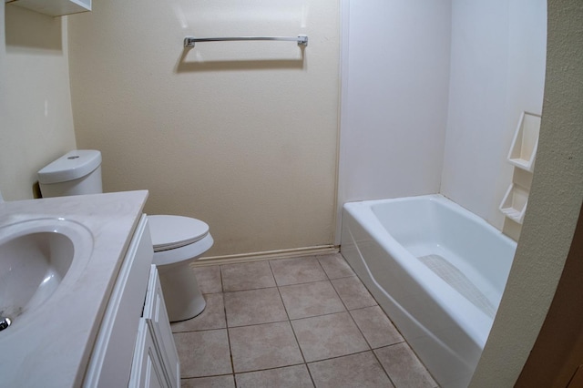 bathroom with vanity, tile patterned flooring, and toilet