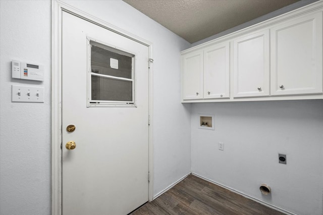 laundry room with dark wood-type flooring, hookup for a washing machine, cabinets, a textured ceiling, and hookup for an electric dryer