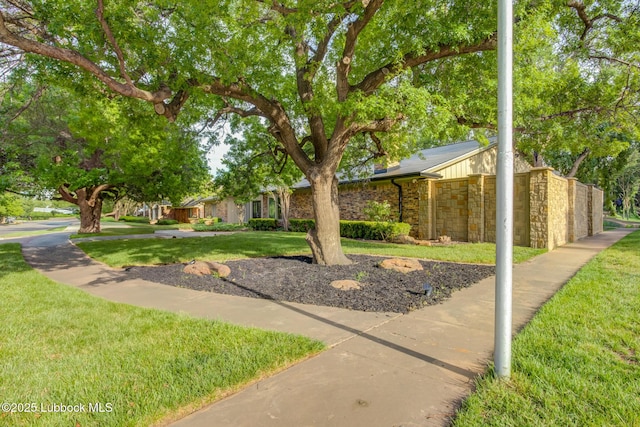 4517 9th St, Lubbock, TX 79416 - view of front facade with stone siding and a front yard