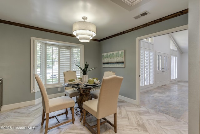 4517 9th St, Lubbock, TX 79416 - dining area featuring baseboards and crown molding
