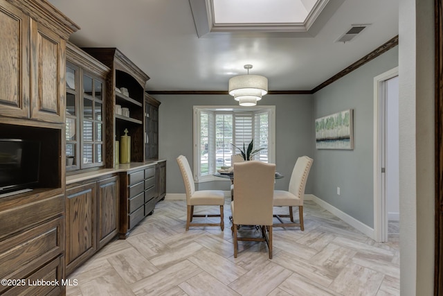 4517 9th St, Lubbock, TX 79416 - dining area featuring baseboards and ornamental molding