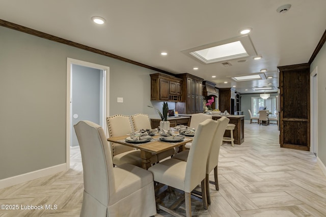 4517 9th St, Lubbock, TX 79416 - dining space featuring ornamental molding, baseboards, recessed lighting, and a skylight