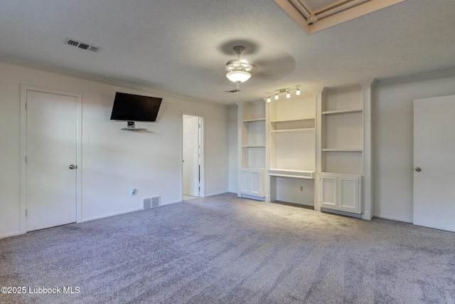 4517 9th St, Lubbock, TX 79416 - unfurnished living room with ornamental molding, ceiling fan, carpet, a textured ceiling, and baseboards