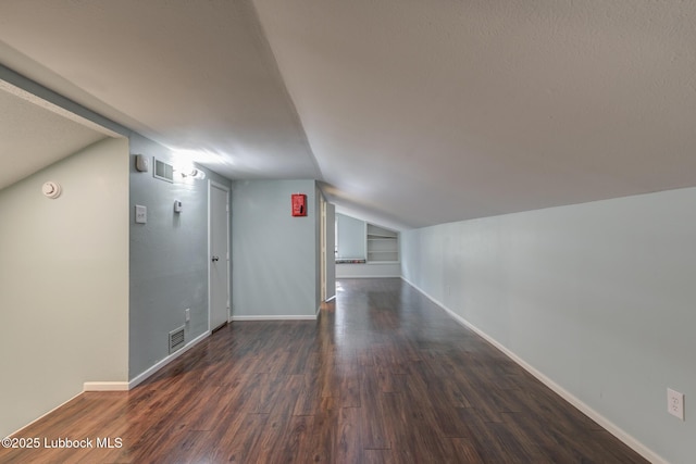 4517 9th St, Lubbock, TX 79416 - bonus room with wood finished floors, lofted ceiling, and baseboards