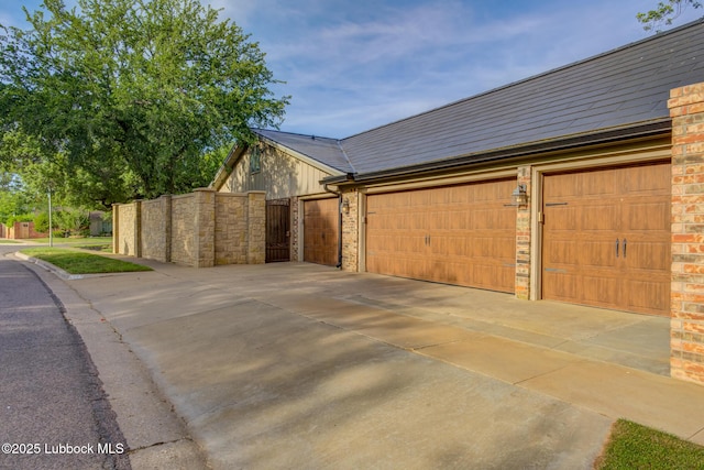 4517 9th St, Lubbock, TX 79416 - garage with driveway and a gate