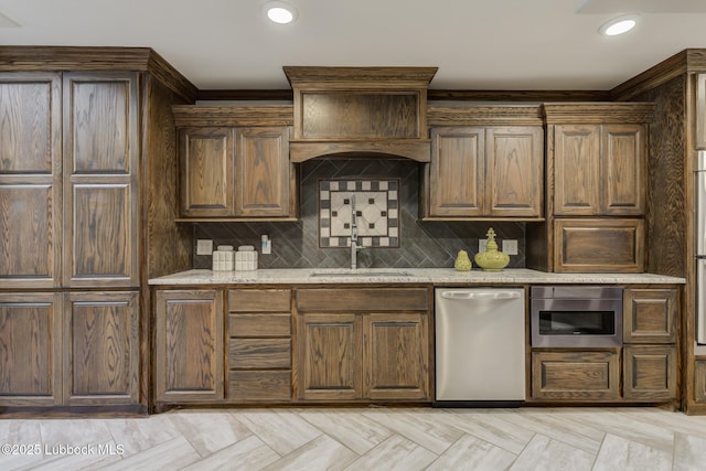 4517 9th St, Lubbock, TX 79416 - kitchen with dishwasher, a sink, light stone countertops, tasteful backsplash, and crown molding