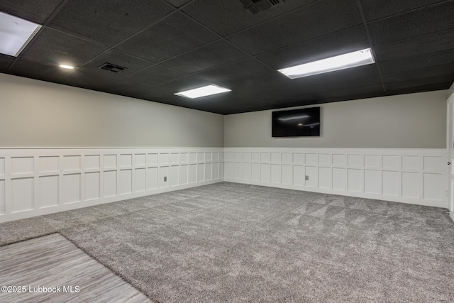 4517 9th St, Lubbock, TX 79416 - unfurnished room featuring wainscoting, a drop ceiling, and wood finished floors
