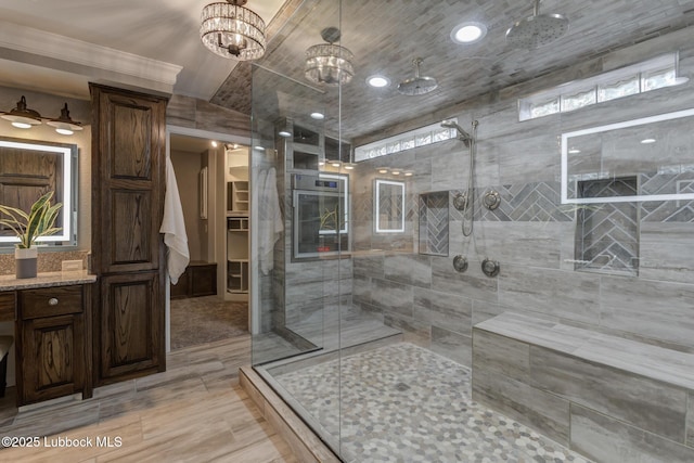 4517 9th St, Lubbock, TX 79416 - bathroom with a shower stall, a chandelier, and vanity