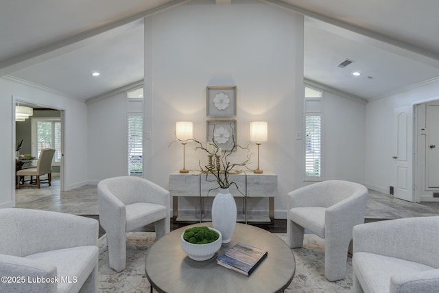 4517 9th St, Lubbock, TX 79416 - living area with lofted ceiling, crown molding, baseboards, recessed lighting, and light marble finish floors