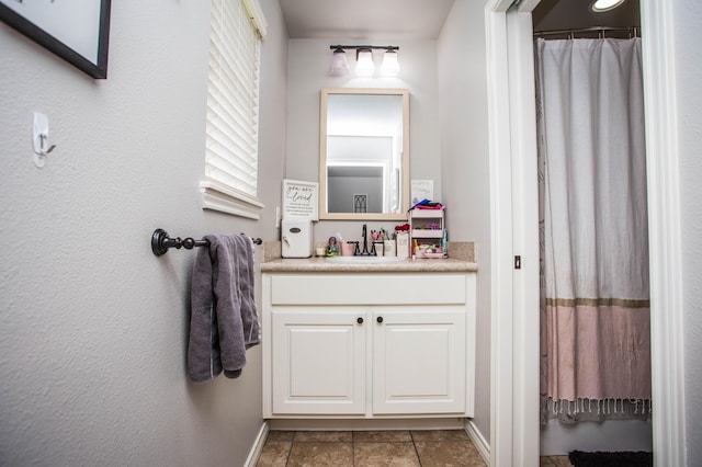2911 111th St, Lubbock, TX 79423 - full bathroom featuring vanity, tile patterned flooring, and a shower with shower curtain