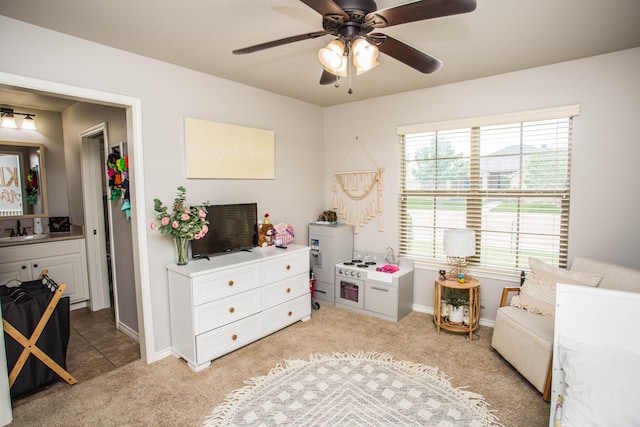 2911 111th St, Lubbock, TX 79423 - bedroom with light carpet and a ceiling fan