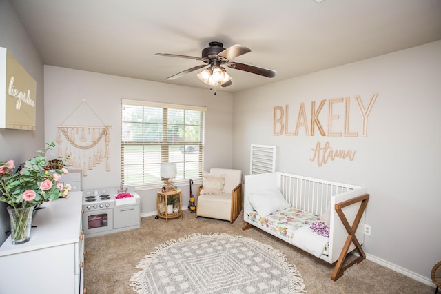 2911 111th St, Lubbock, TX 79423 - bedroom with carpet flooring, a ceiling fan, and a nursery area