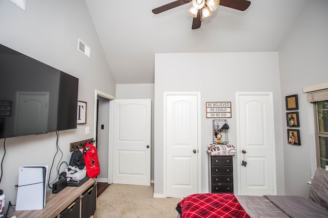 2911 111th St, Lubbock, TX 79423 - bedroom with multiple closets, light colored carpet, ceiling fan, and high vaulted ceiling