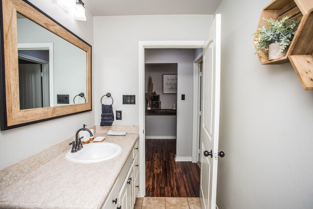 2911 111th St, Lubbock, TX 79423 - bathroom featuring vanity and wood finished floors