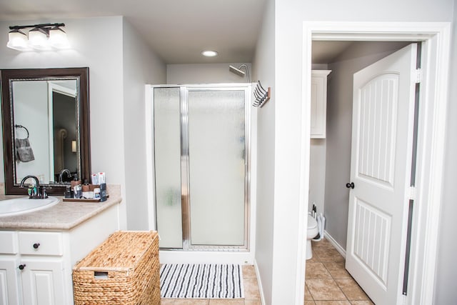 2911 111th St, Lubbock, TX 79423 - full bathroom with a shower stall, vanity, tile patterned flooring, and recessed lighting