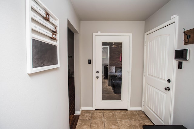 2911 111th St, Lubbock, TX 79423 - doorway featuring tile patterned flooring and baseboards