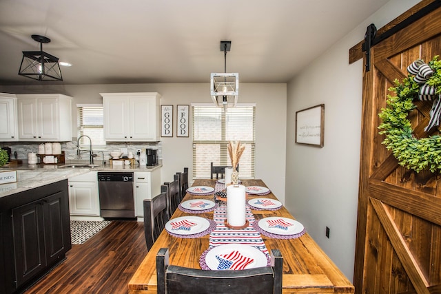 2911 111th St, Lubbock, TX 79423 - dining space with dark wood finished floors and a barn door