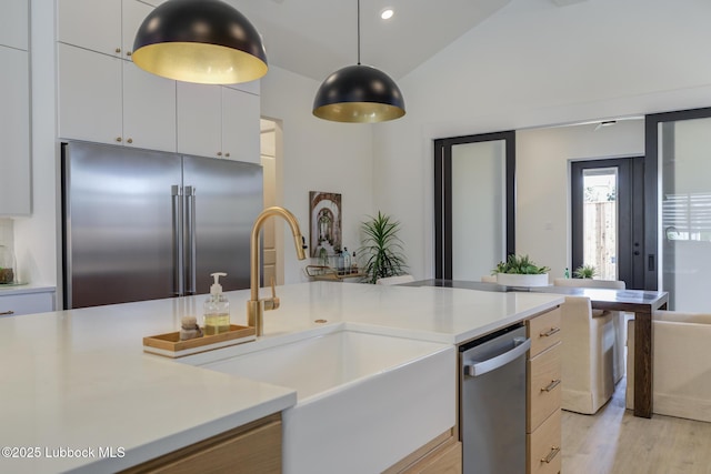 3817 128th St, Lubbock, TX 79423 - kitchen with stainless steel appliances, light countertops, light wood-type flooring, pendant lighting, and recessed lighting