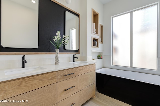 3817 128th St, Lubbock, TX 79423 - full bathroom with plenty of natural light, double vanity, and a bath