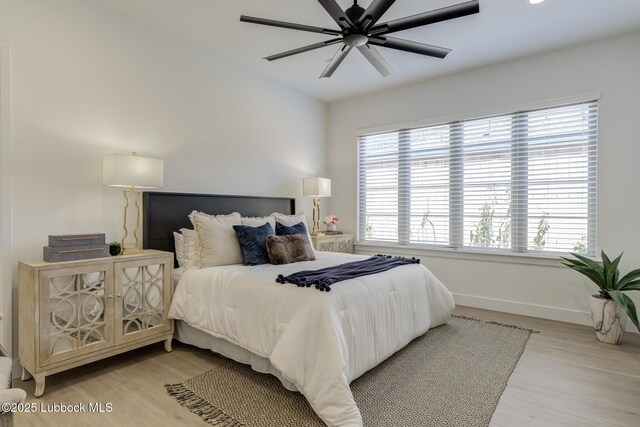 3817 128th St, Lubbock, TX 79423 - bedroom featuring light wood finished floors, multiple windows, ceiling fan, and lofted ceiling