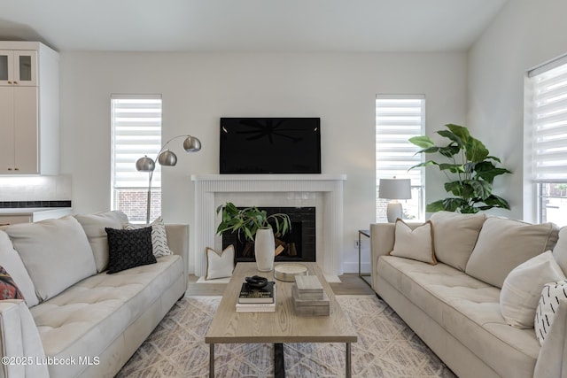 3817 128th St, Lubbock, TX 79423 - living area with a fireplace with flush hearth and light wood-style flooring