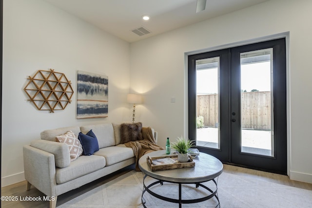 3817 128th St, Lubbock, TX 79423 - living room featuring french doors, plenty of natural light, and light wood-type flooring