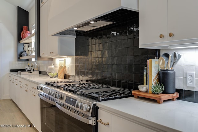 3817 128th St, Lubbock, TX 79423 - kitchen featuring gas range, open shelves, white cabinetry, light countertops, and backsplash