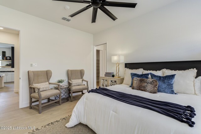 3817 128th St, Lubbock, TX 79423 - bedroom with light wood-style flooring and ceiling fan