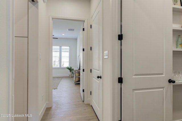 3817 128th St, Lubbock, TX 79423 - corridor featuring baseboards and light wood-style flooring