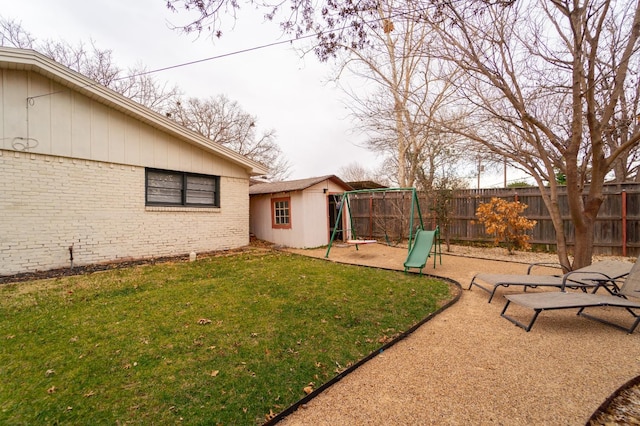 view of yard with an outbuilding and a patio