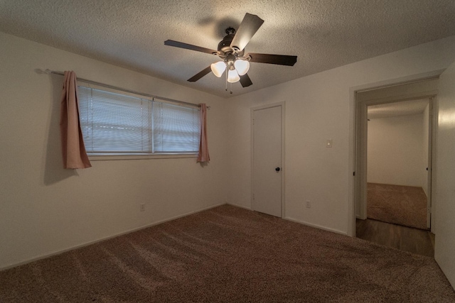 unfurnished bedroom with ceiling fan, carpet floors, and a textured ceiling