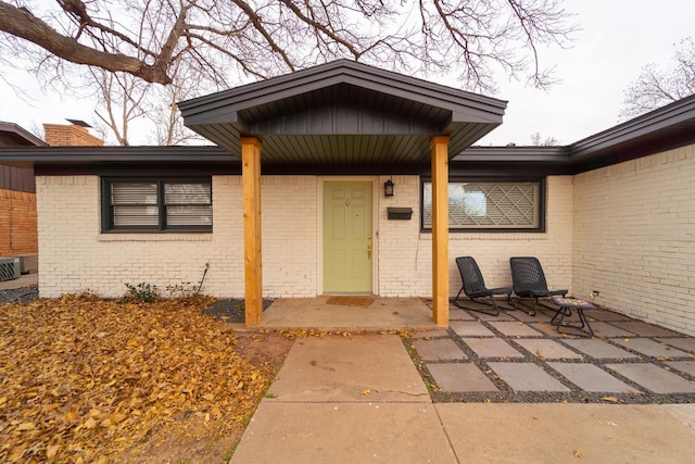 doorway to property with a patio area