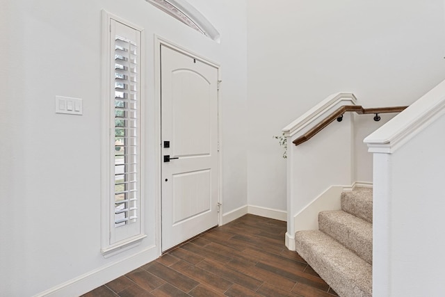 entrance foyer with dark hardwood / wood-style floors