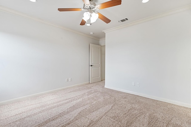 carpeted empty room featuring ornamental molding and ceiling fan