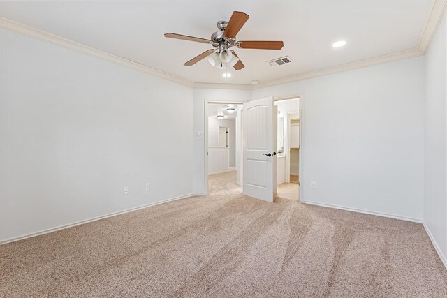 unfurnished bedroom featuring crown molding, ceiling fan, and carpet floors