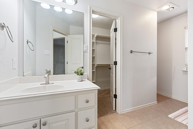 bathroom with vanity and tile patterned flooring