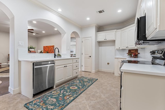 kitchen featuring sink, white cabinetry, crown molding, ceiling fan, and stainless steel appliances