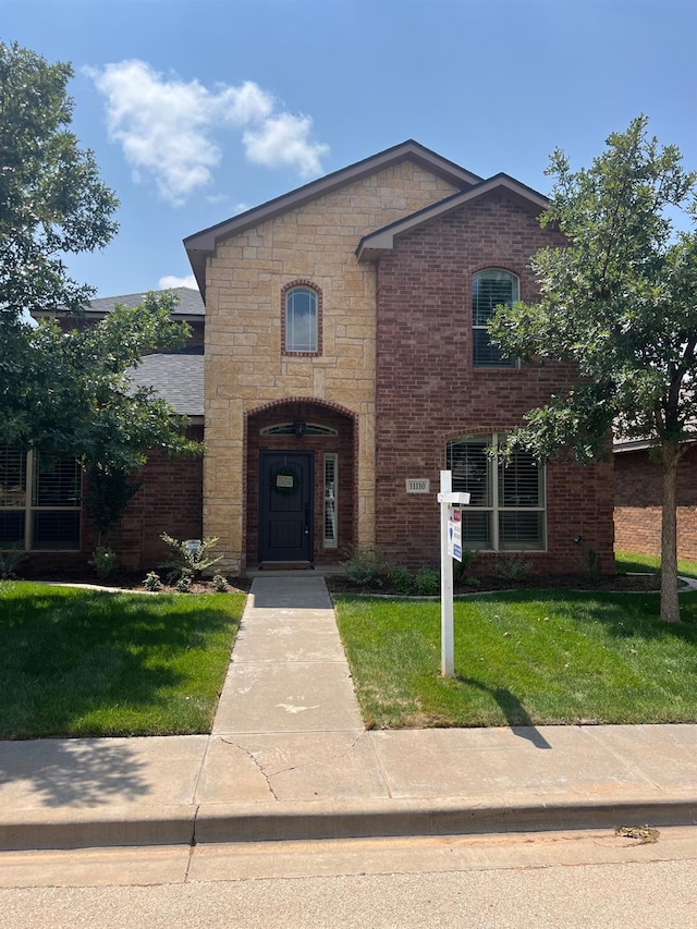 view of front of house with a front lawn