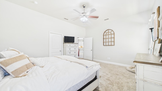 carpeted bedroom with visible vents, ceiling fan, and baseboards