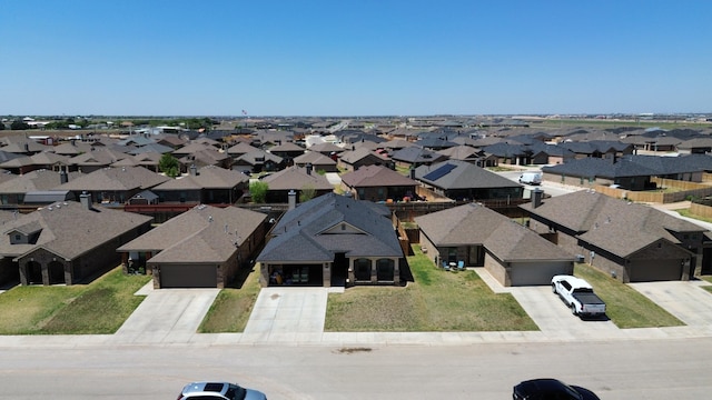 birds eye view of property with a residential view