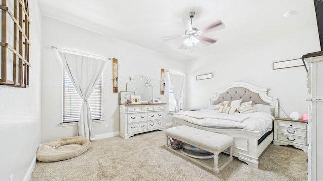 bedroom with baseboards, ceiling fan, and carpet floors