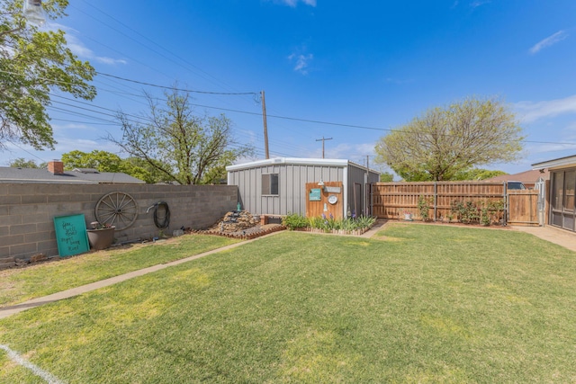view of yard with an outdoor structure, a storage shed, a fenced backyard, and a gate
